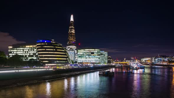 Night illumination of The Shard, London City Hall in Southwark and River Thames