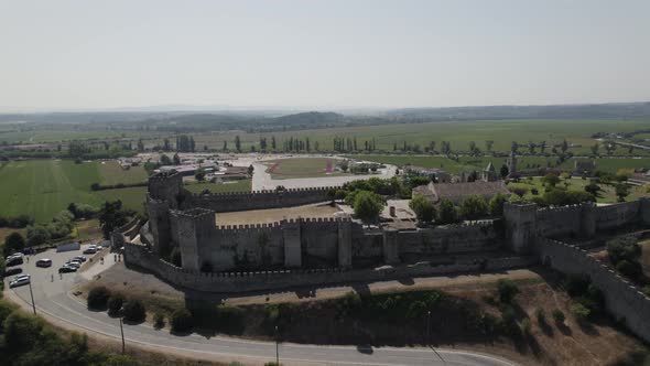 Aerial pullback from Montemor-o-Velho Castle revealing scenic countryside landscape