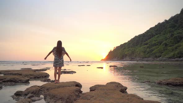 Asian woman enjoy around beautiful beach sea ocean