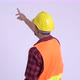Rear View of Young Hispanic Man Construction Worker Directing and Pointing Finger - VideoHive Item for Sale