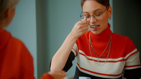 Young Girls Are Discussing News and Drinking Coffee