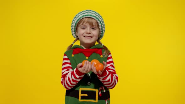 Kid Girl Christmas Elf Santa Helper Costume Holding Mandarin Fruits
