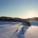Aerial Drone View of a Fields Covered with Winter Snow during Sunset - VideoHive Item for Sale