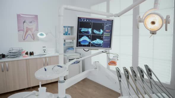 Empty Stomatology Orthodontic Office Room Equipped with Professional Dentistry Tools