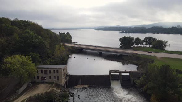 Aerial view of old wheelhouse and dam leading to expansive lake in western Wisconsin.