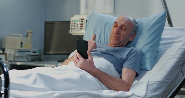 Male Patient Using Video Call in Hospital Room