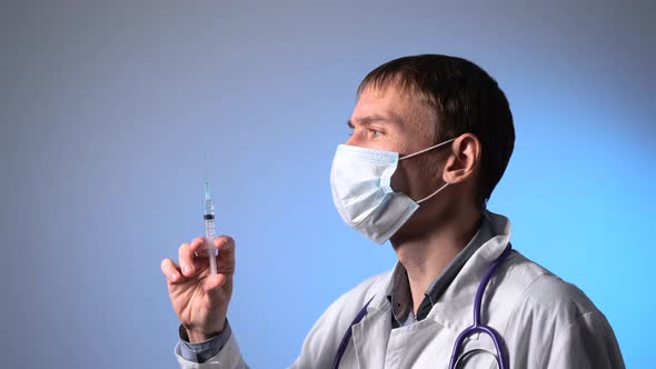 Male Doctor Preparing for Trials Vaccination Shot