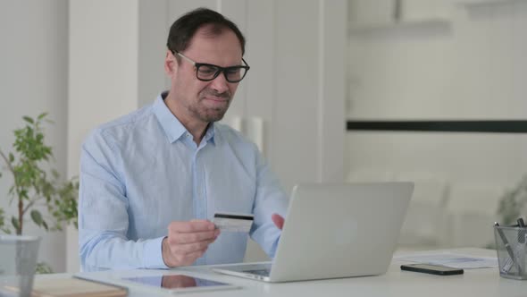 Middle Aged Man Having Online Payment Failure on Laptop
