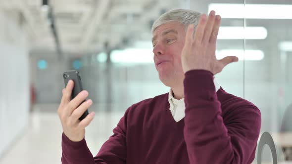 Middle Aged Man Having Loss on Smartphone 