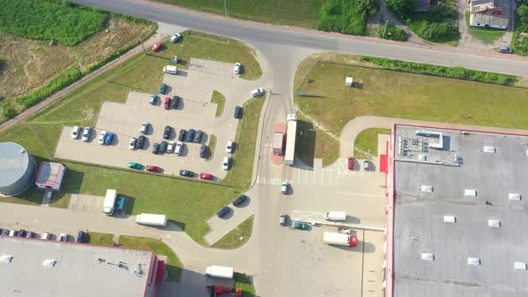 Aerial view of goods warehouse. Logistics center in industrial city zone from above. Aerial view of