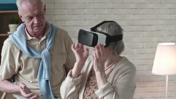 Ecstatic Senior Woman in VR Headset