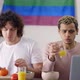 Beautiful Couple Gay on the Kitchen Together Preparing Breakfast Watching News on Laptop - VideoHive Item for Sale