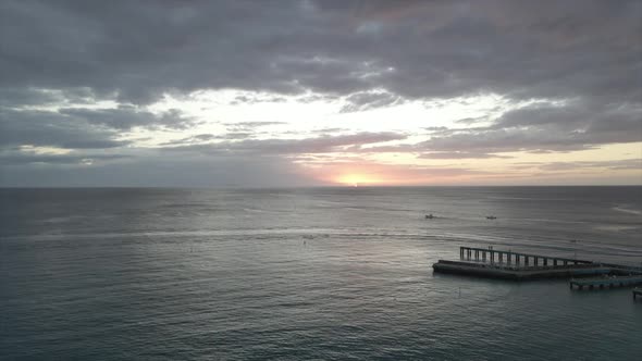 Cloudy sunset sky over endless rippling sea