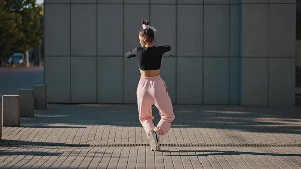 Young Skilled Lady Dancer Performs Vogue Moves at Sunrise