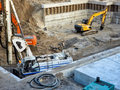 View on the building construction site and working of hevy machines while digging foundation - PhotoDune Item for Sale