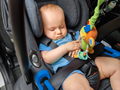 Portrait of cute little baby boy sleeping in car in the safety seat - PhotoDune Item for Sale