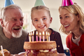 Grandparents With Granddaughter Celebrating Birthday With Party At Home Together - PhotoDune Item for Sale