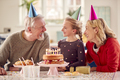 Grandparents With Granddaughter Celebrating Birthday With Party At Home Together - PhotoDune Item for Sale
