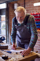 Senior Male Carpenter In Garage Workshop Sketching Out Design On Paper - PhotoDune Item for Sale