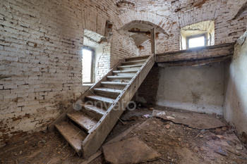ient building or palace with cracked plastered brick walls, small windows, dirty floor and wooden staircase ladder.