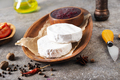 Camembert cheese with figs, raspberry jam. Round brie or camambert cheese on cutting board - PhotoDune Item for Sale