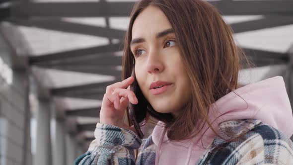 Young Woman Talking on Mobile Phone.