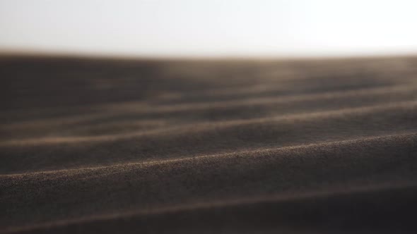 Sand Blowing Over Desert Floor