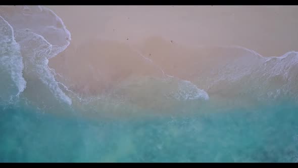 Aerial top down abstract of relaxing bay beach time by transparent sea with white sandy background o