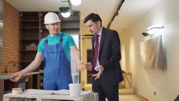 Irritated Annoyed Caucasian Man Arguing with Service Man Delaying Repair and Leaving