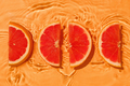 Tropical parts grapefruit fresh organic with vitamins in liquid water with wave motion. - PhotoDune Item for Sale