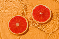 Texture summer citrus red raw fresh grapefruit with fresh water and waves. - PhotoDune Item for Sale