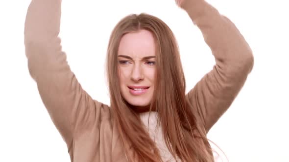 Active Beautiful Young Caucasian Female Smiling Jumping Dancing on White Background in Slowmotion