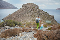 Father and son hiking in mountains on coast - PhotoDune Item for Sale