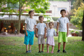 Three young boys and toddler girl in park. Friends or siblings playing outdoors. - PhotoDune Item for Sale