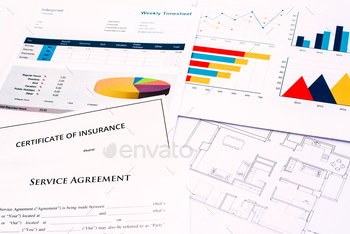 Plans and financial documents with costs, in the real state business.