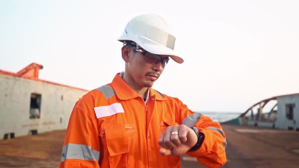 Filipino Deck Officer on Deck of Vessel or Ship , Wearing PPE Personal Protective Equipment