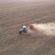 Modern tractor working plowing and sowing on the agricultural field  - VideoHive Item for Sale