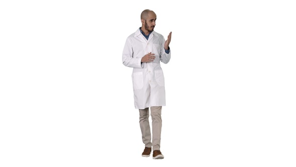 Middle age doctor man wearing medical uniform presenting