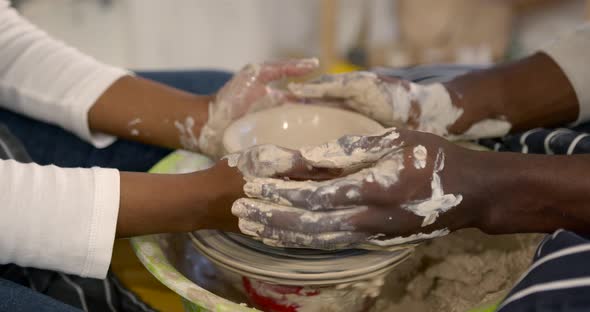 Black Couple in Love Working Together on Potter Wheel