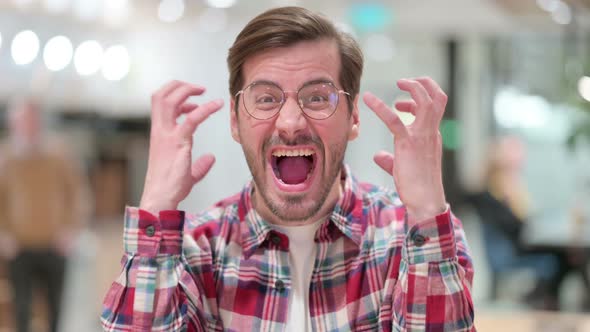 Portrait of Furious Male Designer Shouting, Screaming