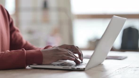 Hands Close up of African Man Working on Laptop