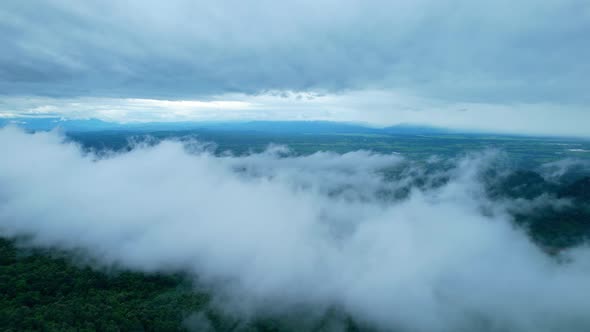 4K Aerial Drone shot flying over beautiful mountain ridge in rural jungle bush forest.