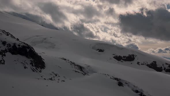 the Timelapse Slope Is the Southern Spruce Movement of Clouds with Wind and Snow Before Sunset. High