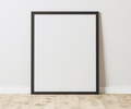 Blank Vertical black frame on wooden floor with white wall, 4:5 ratio - 40x50 cm, 16 x 20 inches - PhotoDune Item for Sale