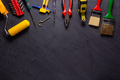 Construction tools on black slate background. Construction concept - PhotoDune Item for Sale