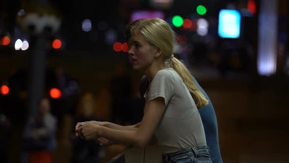 Young Couple Arguing and Braking Down Relationship, Night Street Background