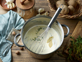 pot with hot mixed milk cream and herbs - PhotoDune Item for Sale