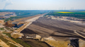 Panorama of Garzweiler surface mine in Germany with heavy machinery and power plant in the distance - PhotoDune Item for Sale