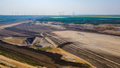 Panorama of Garzweiler surface mine in Germany with heavy machinery and power plant in the distance - PhotoDune Item for Sale