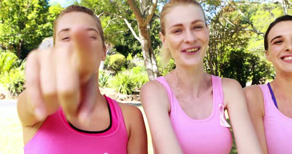 Portrait of female volunteers gesturing in park